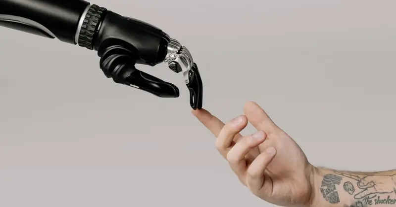 Robotic hand reaching to touch a human hand, people and AI working together
